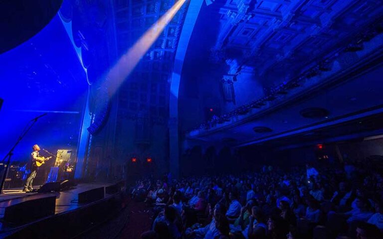 side view of stage with guitar performer and seating area at florida theatre jacksonville