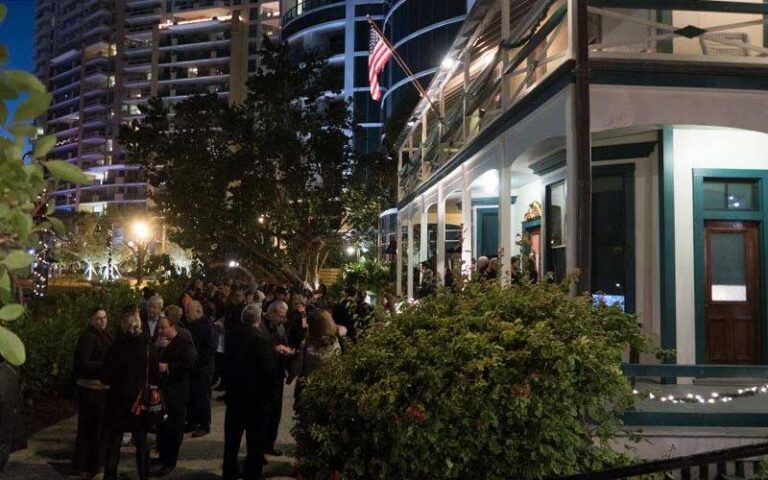 sidewalk area in front of victorian style house at night event at historic stranahan house museum ft lauderdale