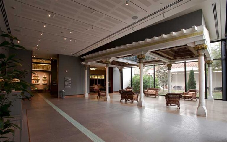 sitting area with atrium benches and trellis at morse museum orlando