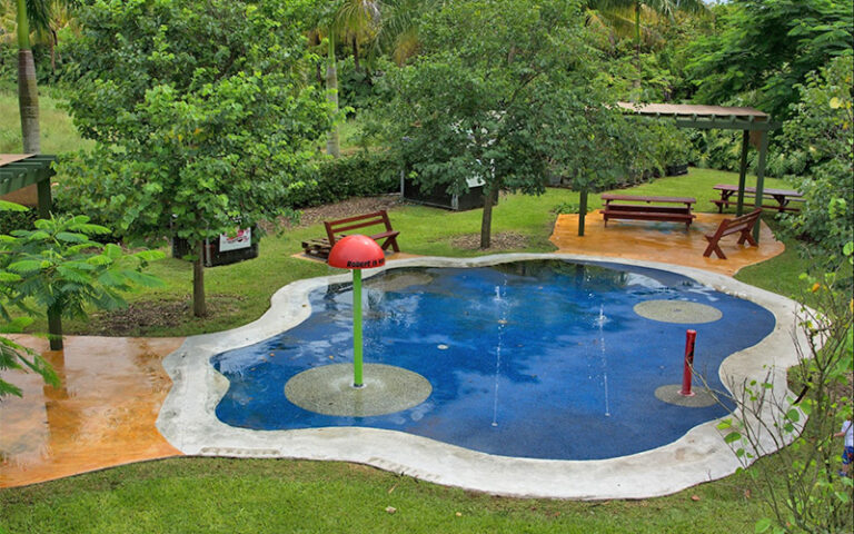 splash pad for kids in farm area with park benches at robert is here fruit stand homestead