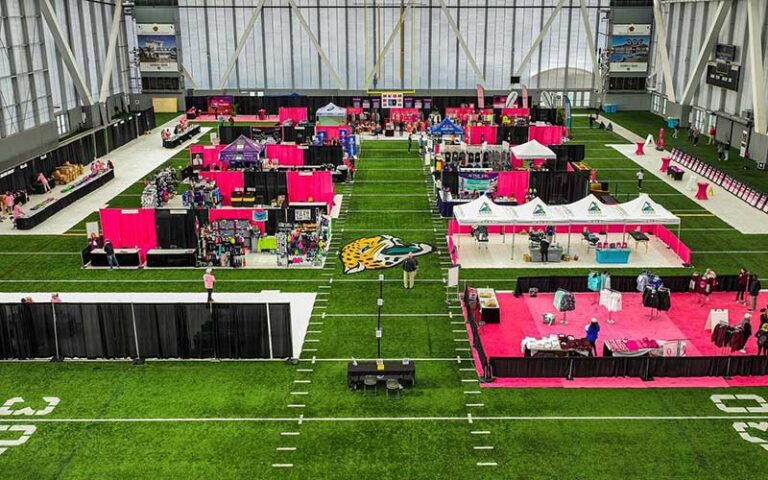 sports stadium field with many booths for expo at tiaa bank field jacksonville