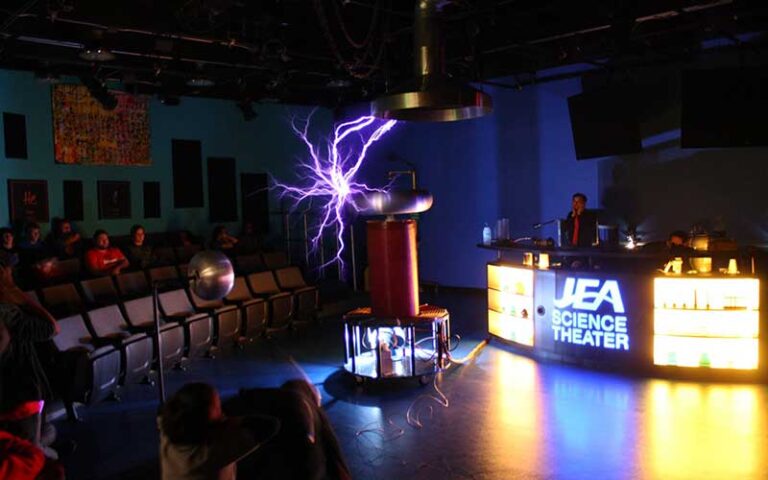 stage with lightning electricity show with kids seated theater style at mosh museum of science history jacksonville