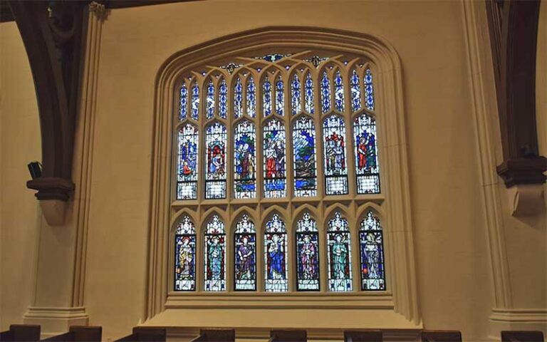 stained glass array window with saints from inside church at st johns cathedral jacksonville