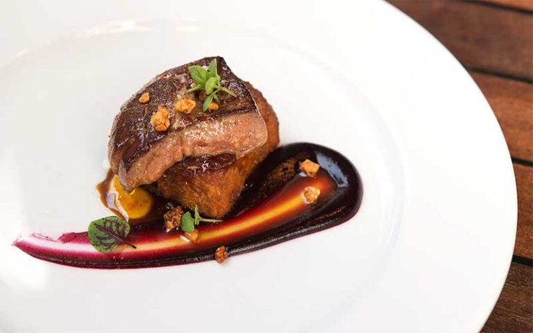 steak entree on plate with glaze at orsay jacksonville