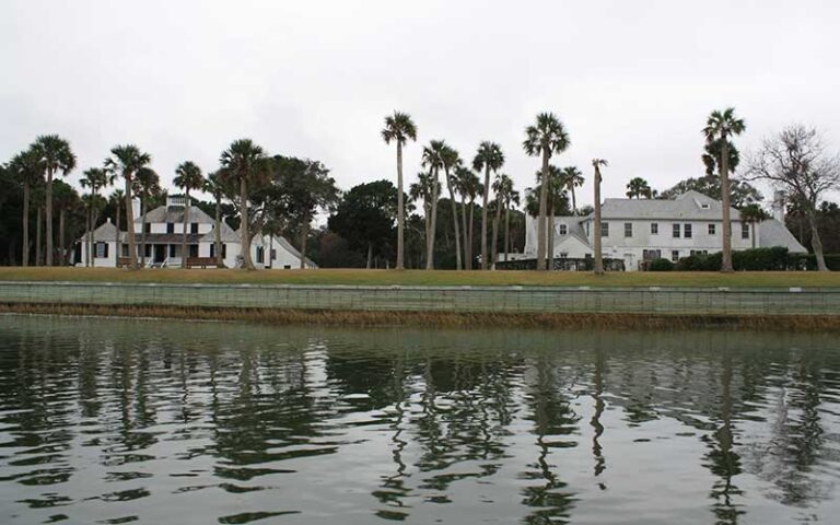 waterfront property with two historic homes and palm trees at kingsley plantation jacksonville