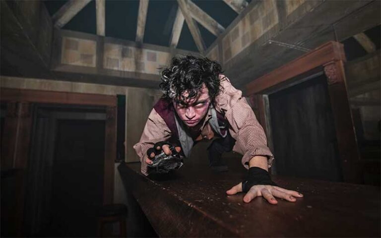 zombie character reaching forward with creepy look at 13th floor haunted house jacksonville