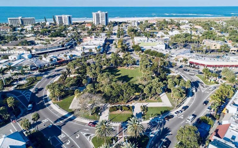 aerial view of circular park area with trees and round about streets at st armands circle sarasota