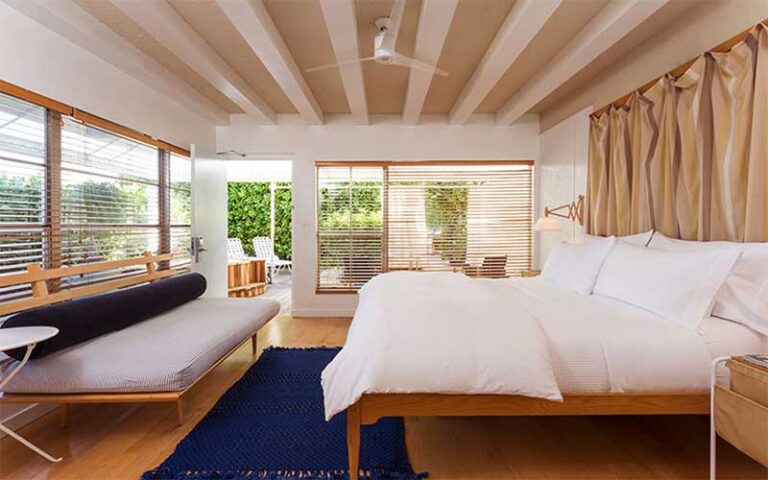 cabana style suite with bed and windows at the standard spa miami beach