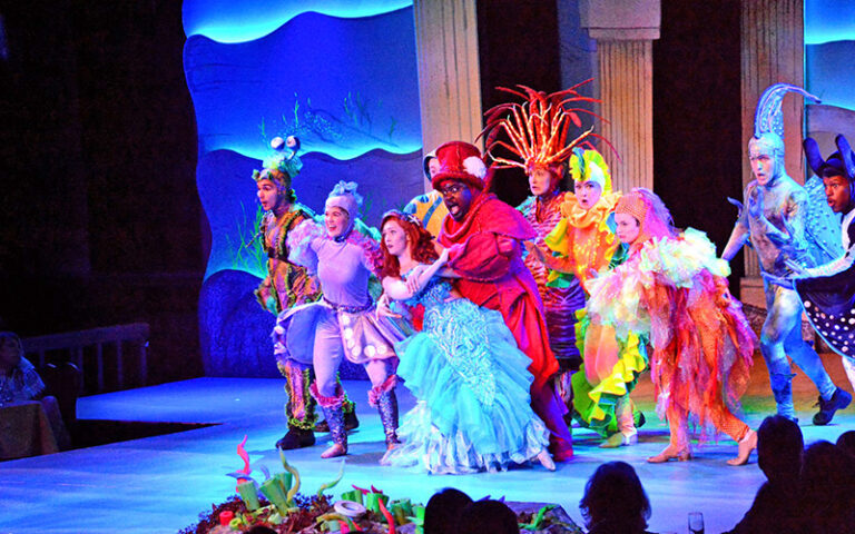 colorful cast of little mermaid on stage at alhambra theatre jacksonville