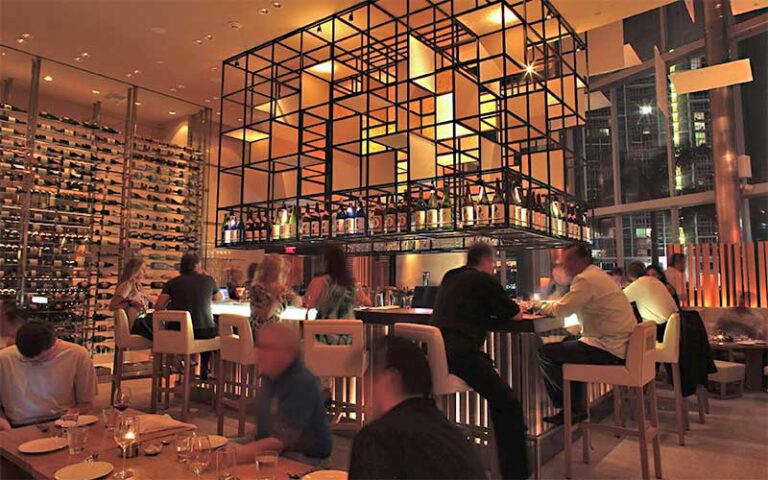 dining room with wine rack over bar area at zuma miami