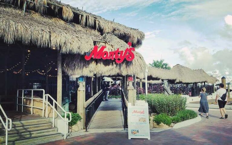 entrance to bar area with island style huts at montys coconut grove miami