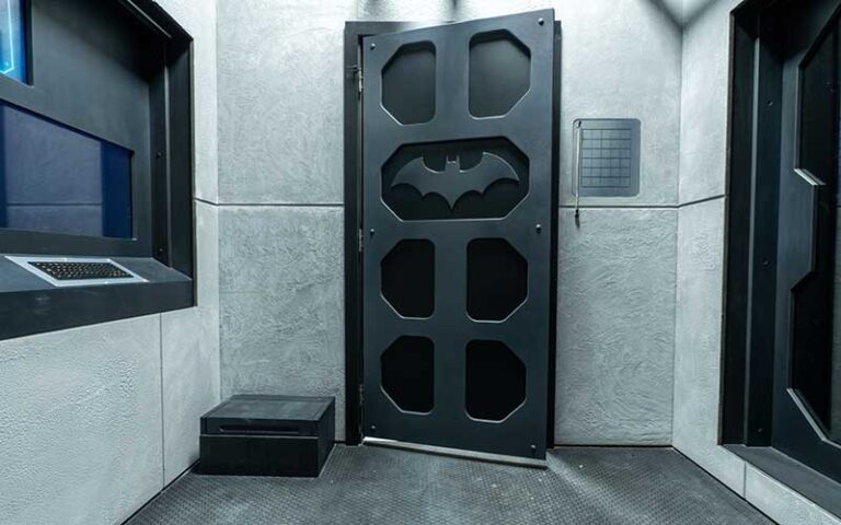 escape room with batman theme door and display at escapology jacksonville