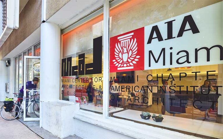 front shop windows on street with biker at miami center for architecture design