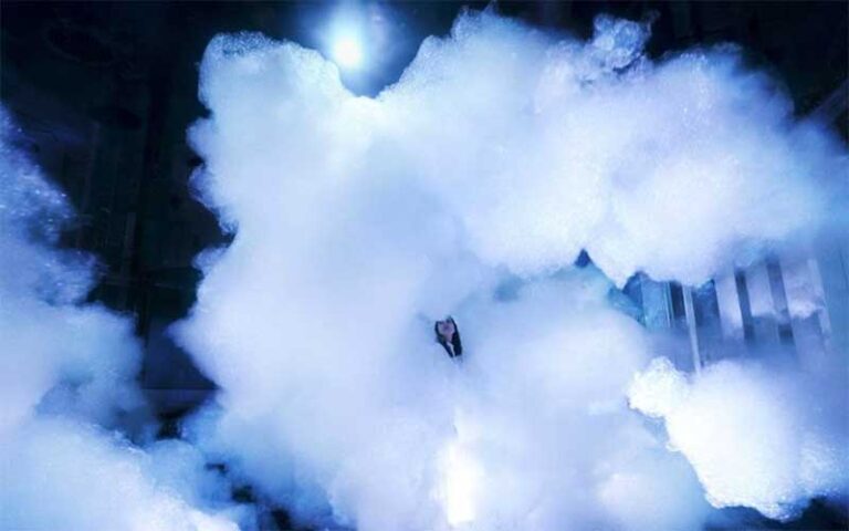 girl stands in cloud like area at superblue miami