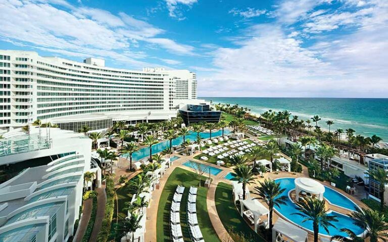 hotel exterior on beach with pool area at fontainebleau miami beach