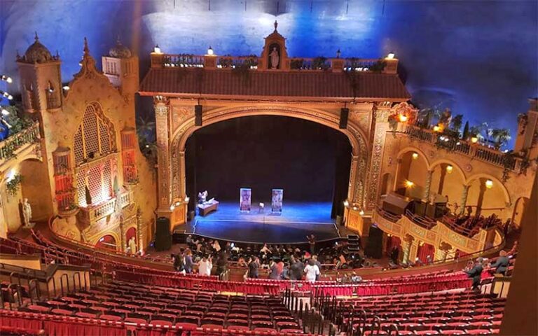 indoor theater stage with italian setting and red seats at olympia theater miami