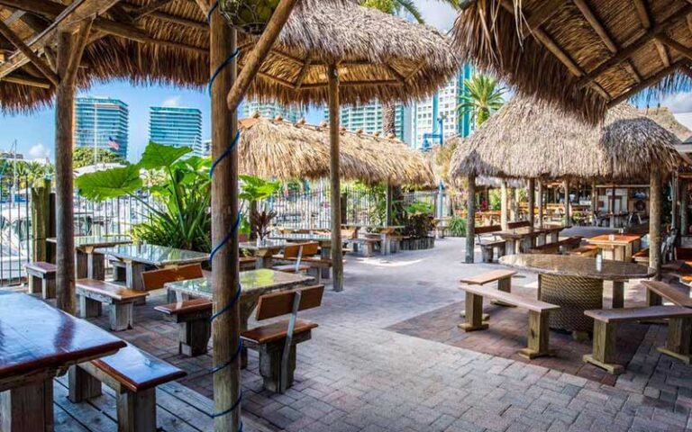 island themed dining patio with huts and lighting at montys coconut grove miami