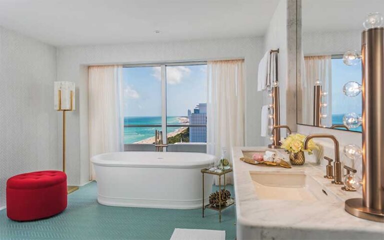 luxury suite bathroom with beach view at faena hotel miami beach