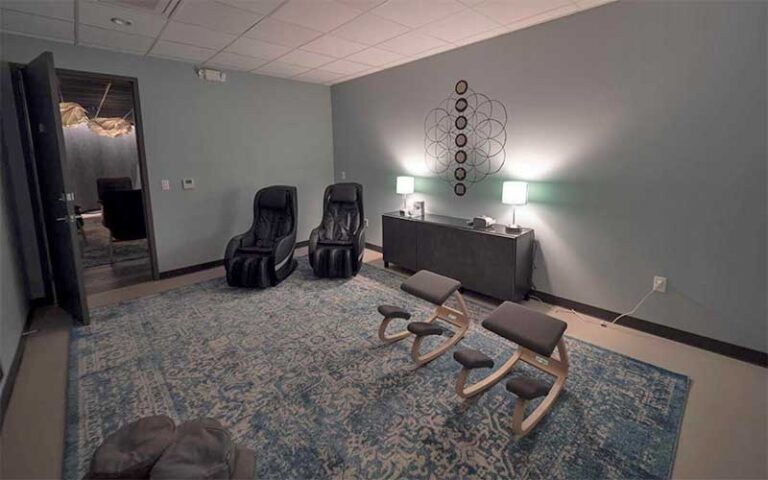 massage room with chairs and lamps at be still float studio jacksonville