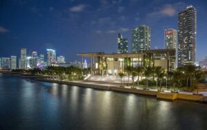 night exterior over bay with city skyline at perez art museum miami