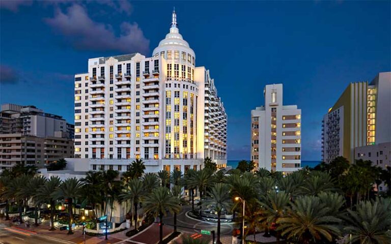 night exterior of high rise with street at loews miami beach hotel