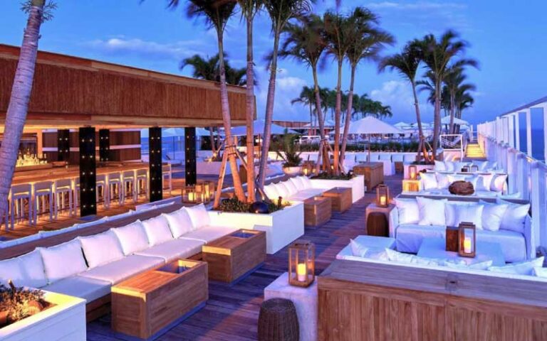 outdoor patio bar event area at night with lighting at 1 hotel south beach miami