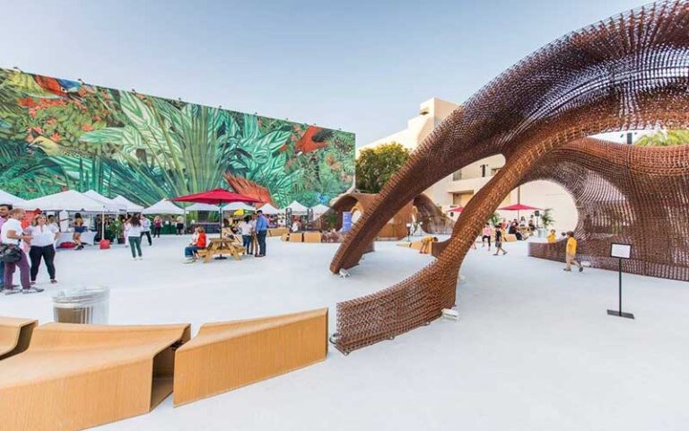 outdoor market area with sculpture art and murals at miami design district