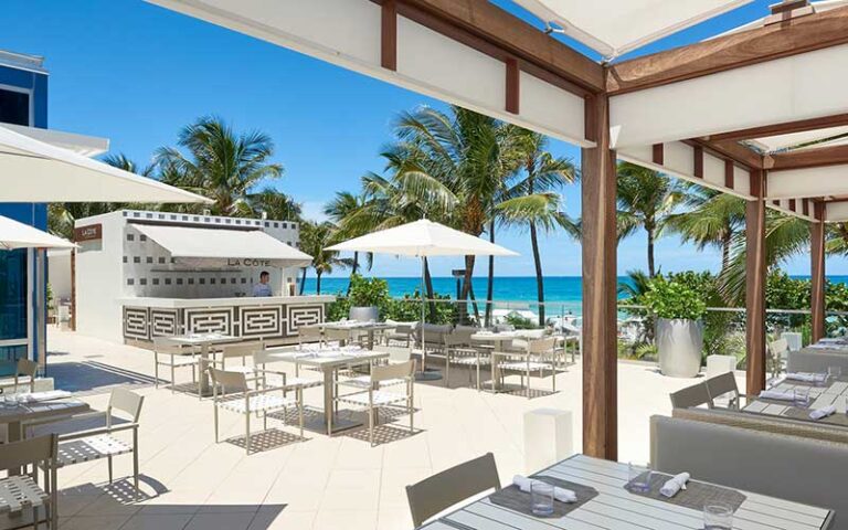 patio area with bar at fontainebleau miami beach