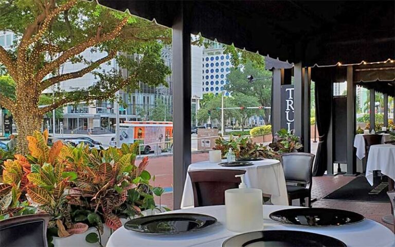 patio seating area under awning with street view at trulucks miami