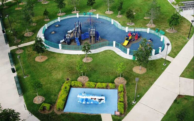 playgrounds on blue pads with surf sculpture in park at bayfront park miami