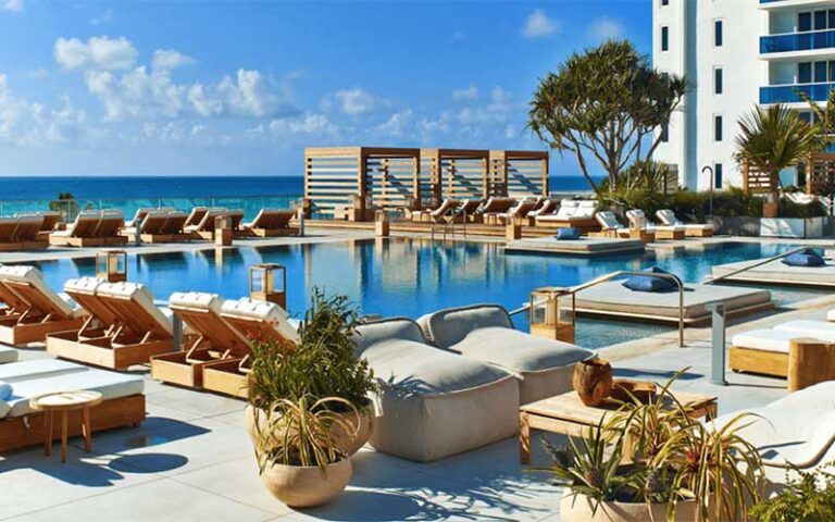 pool area with seating and building at 1 hotel south beach miami