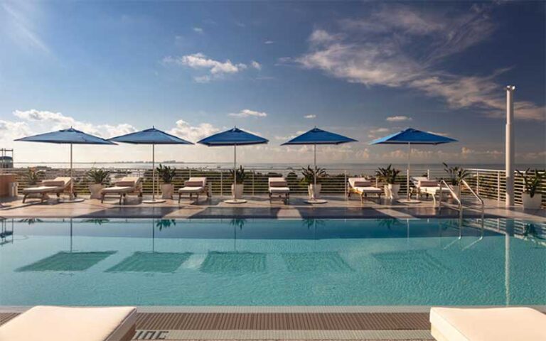 pool deck with blue square umbrellas at mr c miami