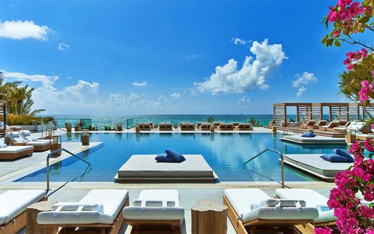 pool deck with ocean view cabanas lounges and flowers at 1 hotel south beach miami