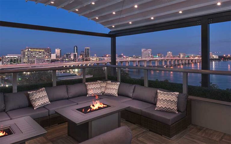 rooftop seating with city skyline at night at river post jacksonville