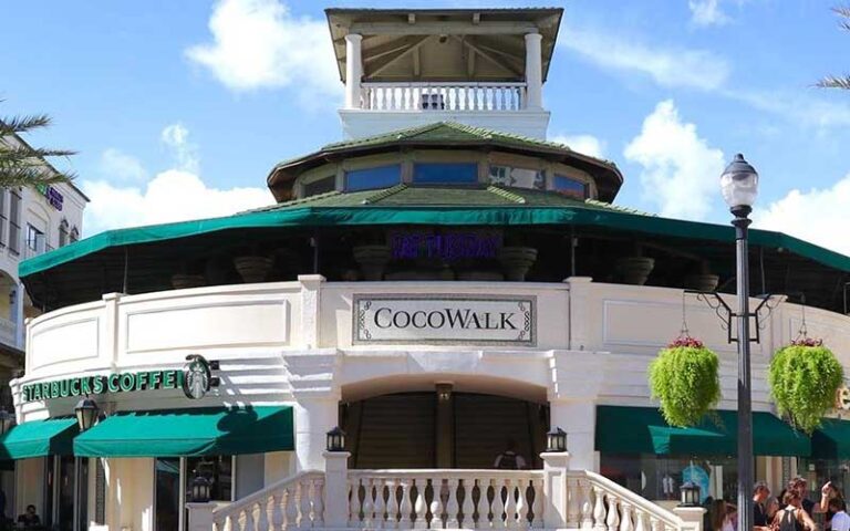round front entrance with stairs and starbucks sign at cocowalk miami