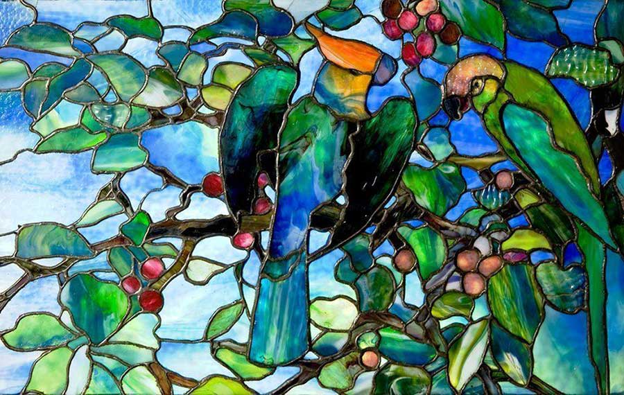stained glass piece of two tropical birds on branches at morse museum