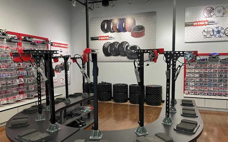 store area with racks of toy car parts and build tables at ridemakerz store orlando