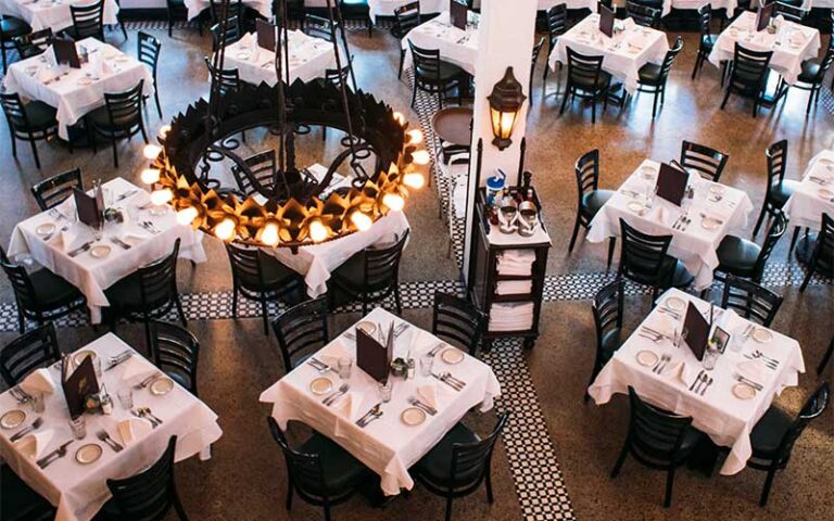 upscale dining room view from above with chandelier at joes stone crab miami