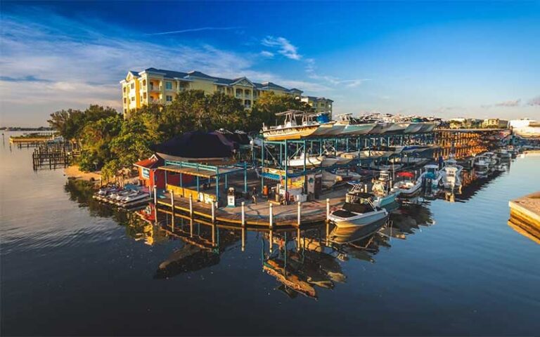 aerial view of colorful marina with reflections and stacked boats at safe harbor siesta key sarasota