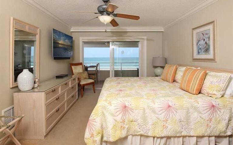 bedroom with tropical decor and beach view at horizons west condo rentals sarasota