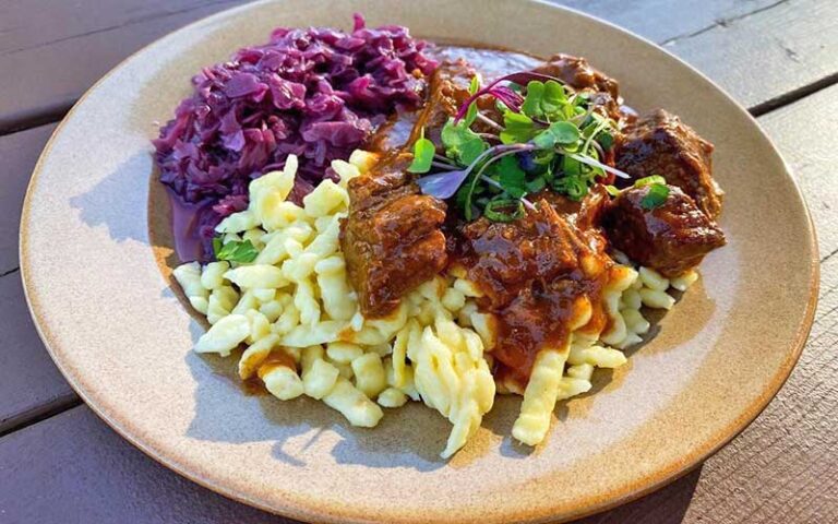 entree with red cabbage noodles and meat at siegfrieds restaurant sarasota