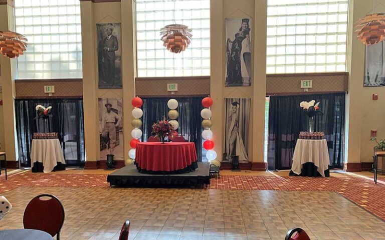 event space with dais and historic portraits of performers at ritz theatre museum jacksonville