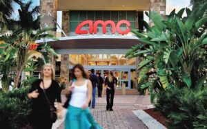 exterior of theater with women walking and amc sign at sarasota square mall