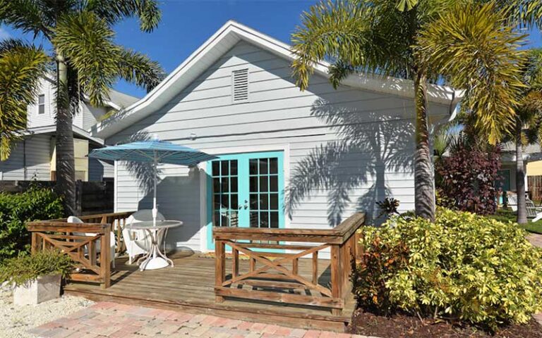 exterior of villa with patio and trees at cottages at siesta key sarasota
