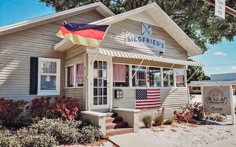 front exterior of homelike restaurant with german flag at siegfrieds restaurant sarasota