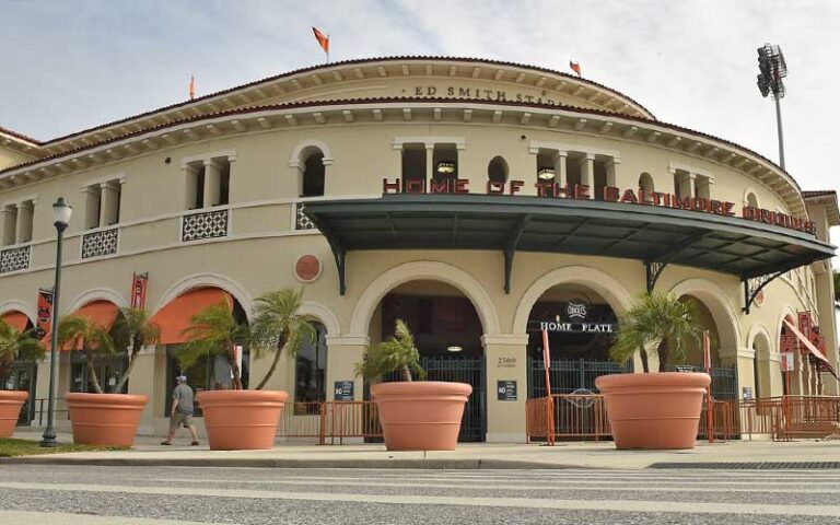 front exterior of stadium entrance with large tree pots at ed smith stadium sarasota