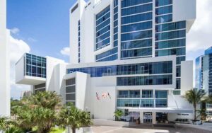 front exterior of white skyscraper building with blue windows at westin sarasota