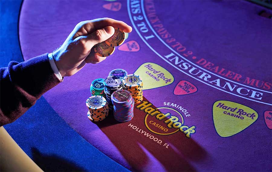 hand with chips at gaming table seminole hard rock casino ft lauderdale