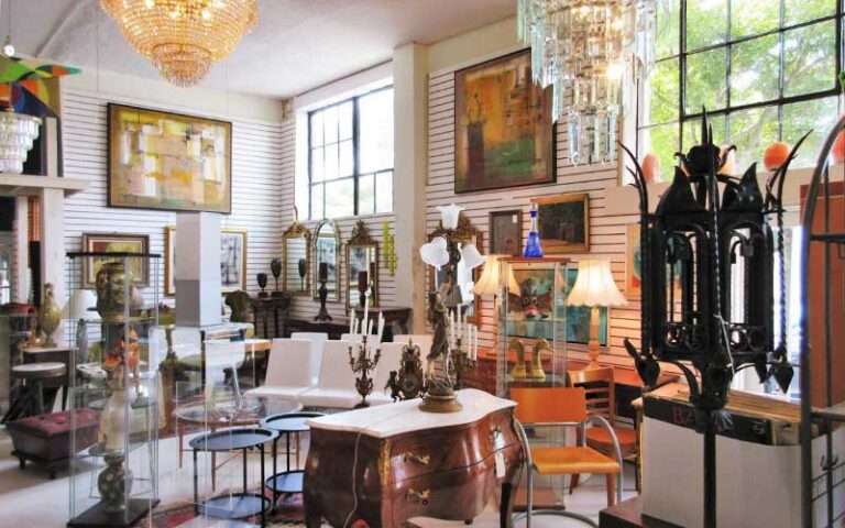 interior of store with chandeliers and furniture at sarasota trading company