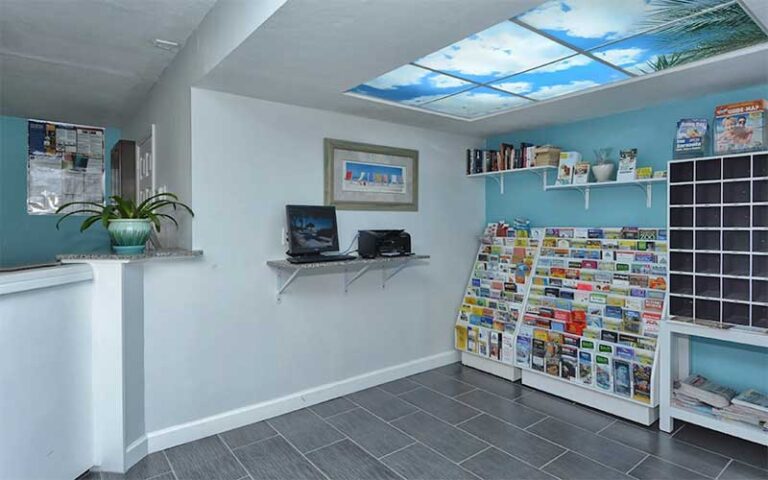 lobby area with desk and brochure racks at sea shell condominium sarasota